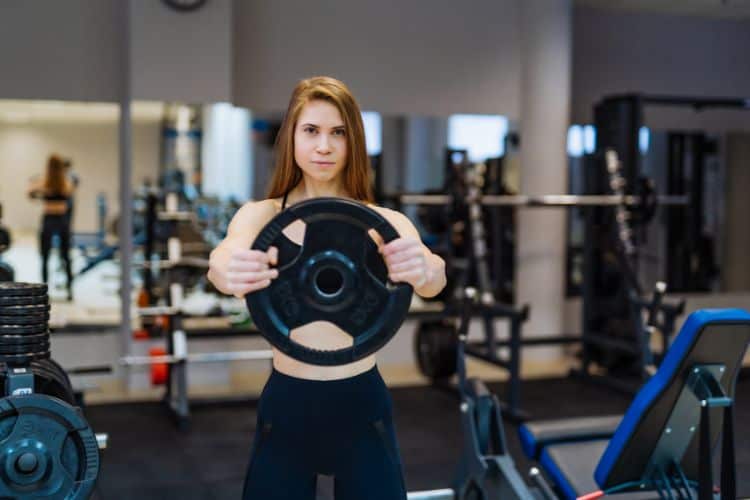 workout with weight plate
