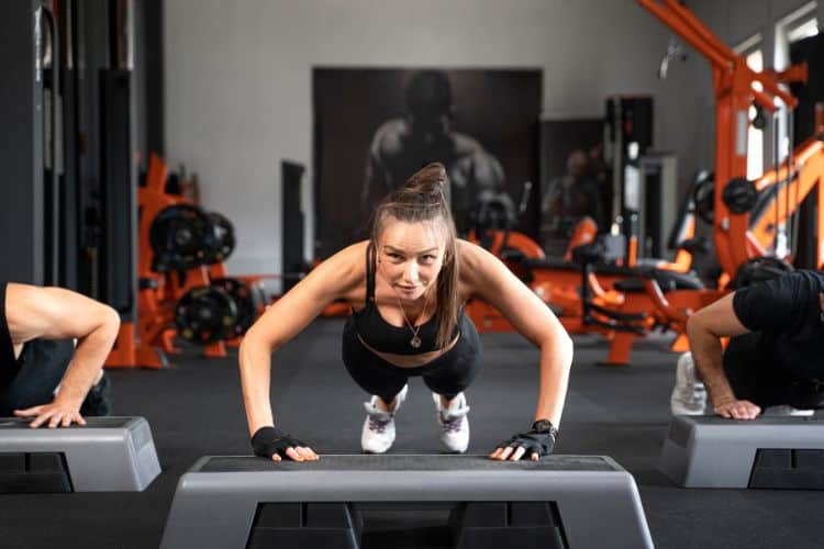 Woman performing jump squats during a 15 minute full body HIIT workout
