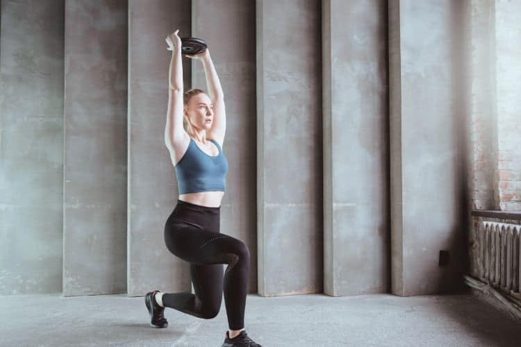 Woman doing squats during a 15 minute full body workout