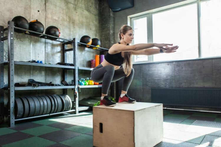 Woman doing squats during a 20-minute lower body workout