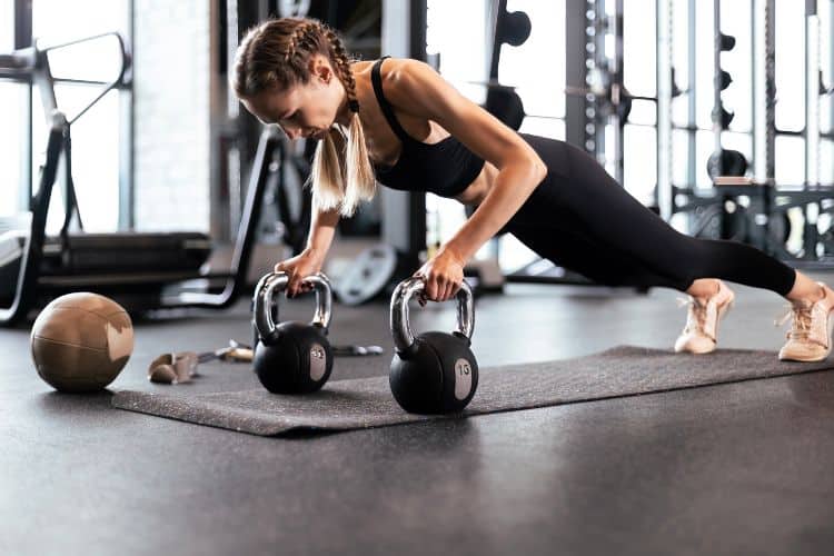 Woman performing squats during a 20-minute full body workout exercise
