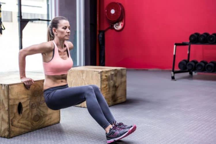 Woman performing push-ups during a 20 minute upper body HIIT workout