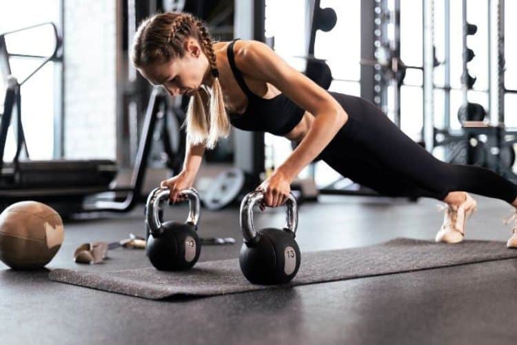 Woman performing burpees during a 30-day workout challenge