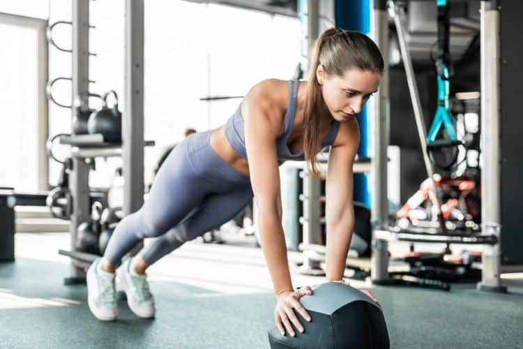 woman doing burpees during a 10 minute HIIT workout