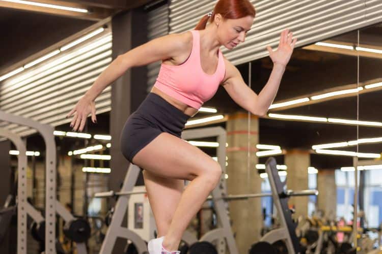 Woman performing burpees during a 10 full body cardio workout