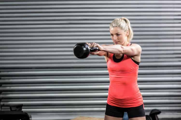 Kettlebell swings exercise as part of a 30-minute full body compound workout