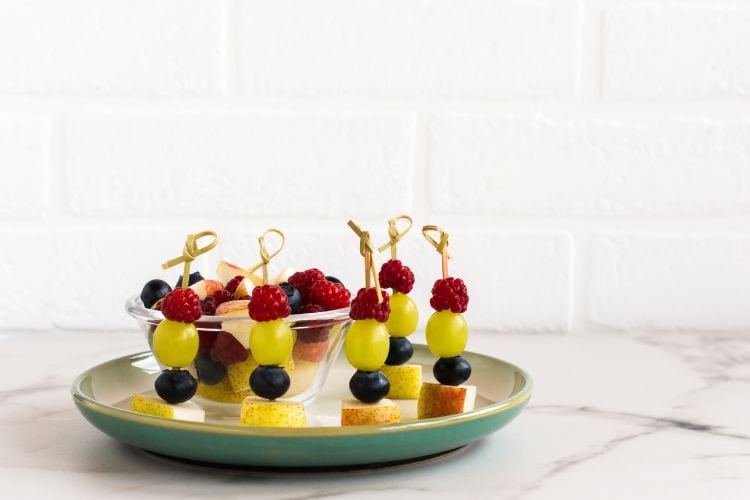 Kid-friendly school lunch snack ideas including apple slices with peanut butte