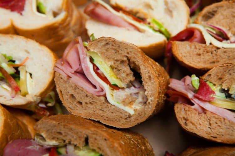 Easy school lunch idea with turkey wraps, carrot sticks, and apple slices