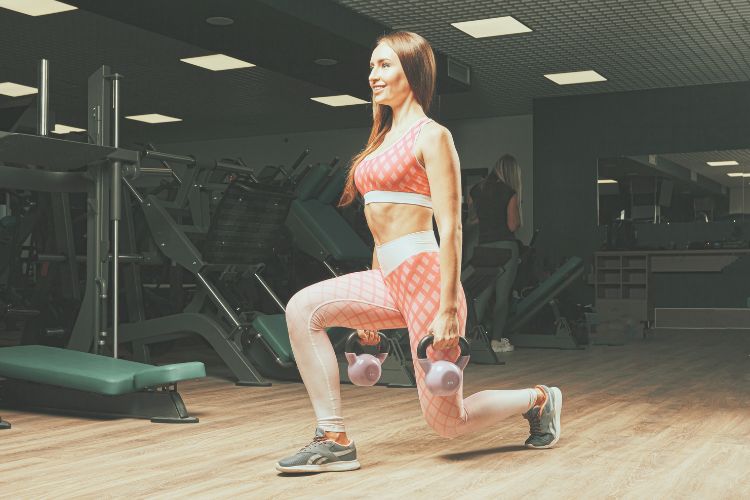 Woman performing dumbbell squats in a 30-minute full body workout split