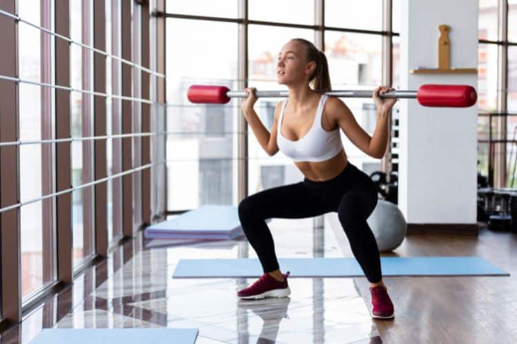 Best Squats for Women: Legs and Glutes” in peach and navy colors