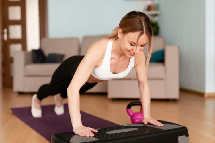 Woman doing push up as part of a Thanksgiving morning workout.